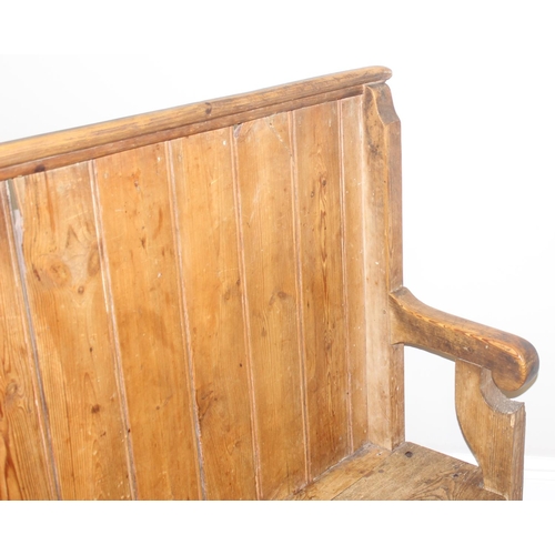 2 - An unusual antique pine pew or bench with high panelled back, one end shaped for corner, likely 19th... 