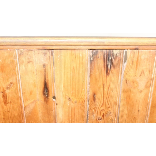 2 - An unusual antique pine pew or bench with high panelled back, one end shaped for corner, likely 19th... 