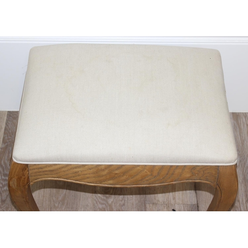 20 - A French style light oak stool with cream upholstered top, approx 54cm wide  x 40cm deep x 46cm tall