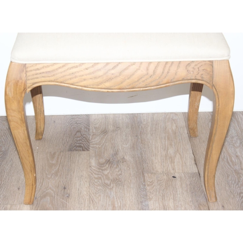 20 - A French style light oak stool with cream upholstered top, approx 54cm wide  x 40cm deep x 46cm tall