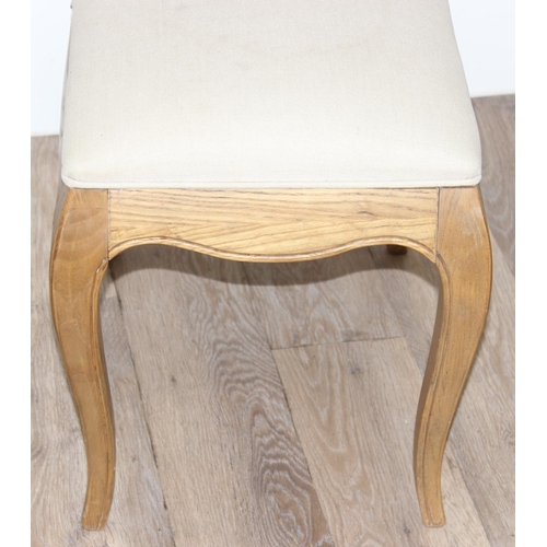 20 - A French style light oak stool with cream upholstered top, approx 54cm wide  x 40cm deep x 46cm tall