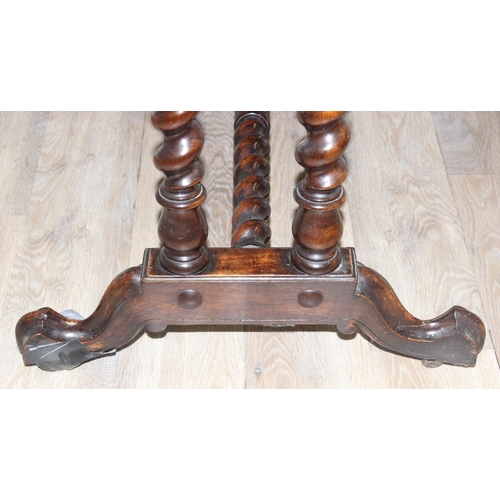 21 - A 19th century mahogany sofa table with barley twist supports and brass handles and accents, approx ... 