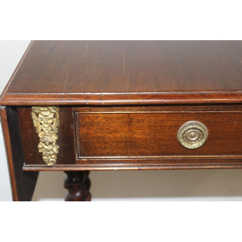 21 - A 19th century mahogany sofa table with barley twist supports and brass handles and accents, approx ... 