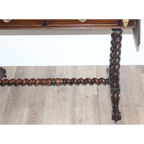 21 - A 19th century mahogany sofa table with barley twist supports and brass handles and accents, approx ... 