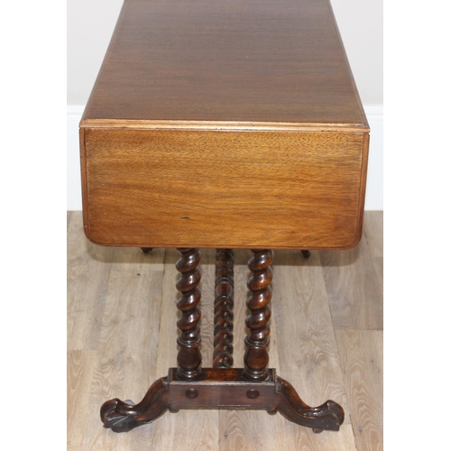 21 - A 19th century mahogany sofa table with barley twist supports and brass handles and accents, approx ... 