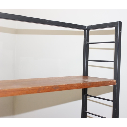 22 - A retro mid-century Ladderax style bookcase with 6 shelves, 10 metal suspension bars and a black pai... 