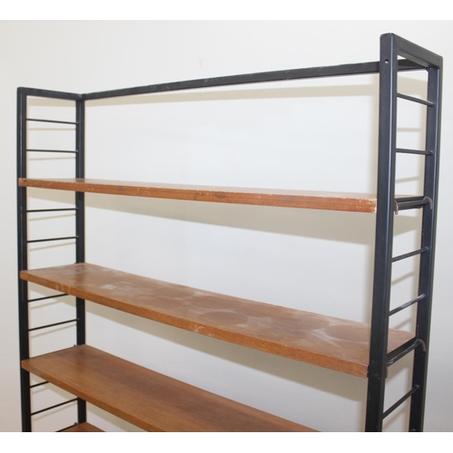 22 - A retro mid-century Ladderax style bookcase with 6 shelves, 10 metal suspension bars and a black pai... 