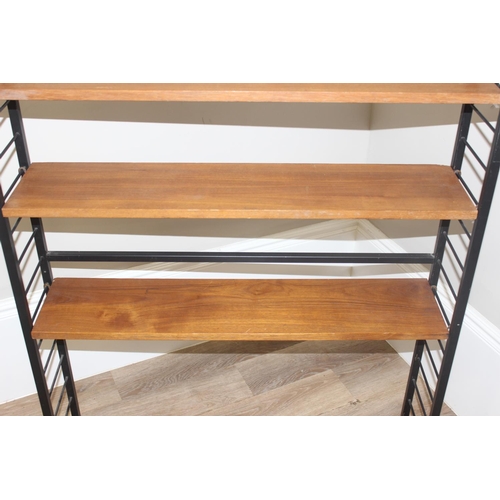 22 - A retro mid-century Ladderax style bookcase with 6 shelves, 10 metal suspension bars and a black pai... 