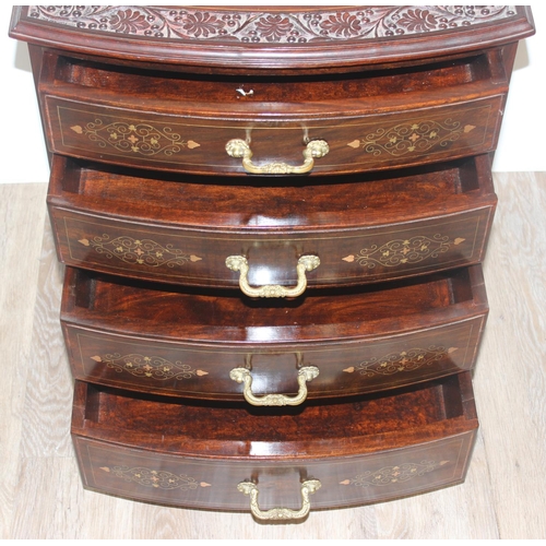 23 - A small vintage Indian style carved 4 drawer chest of drawers with brass inlay and fittings, approx ... 