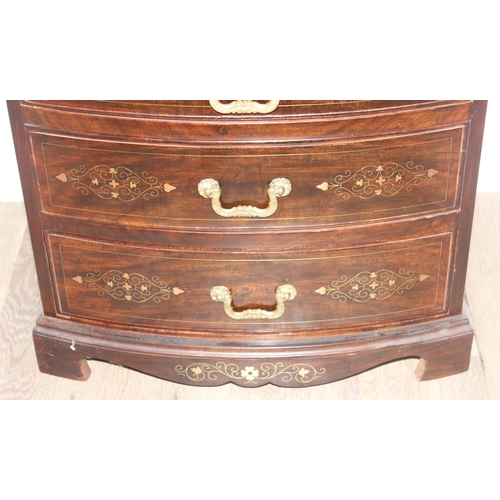 23 - A small vintage Indian style carved 4 drawer chest of drawers with brass inlay and fittings, approx ... 