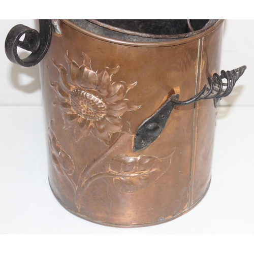 270 - An Arts & Crafts period hammered copper coal scuttle with twisted wrought iron fittings, the copper ... 