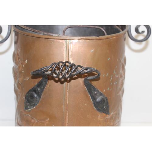 270 - An Arts & Crafts period hammered copper coal scuttle with twisted wrought iron fittings, the copper ... 