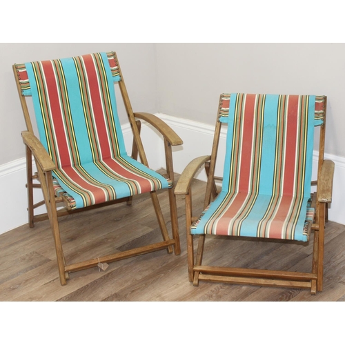 300 - 2 vintage wooden folding deck chairs with colourful fabric, largest approx 110cm tall