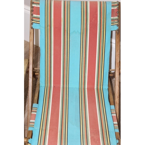 300 - 2 vintage wooden folding deck chairs with colourful fabric, largest approx 110cm tall