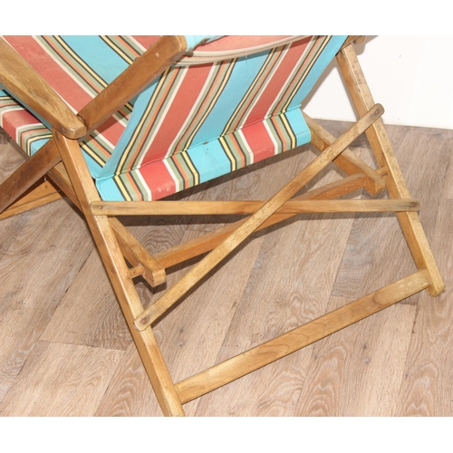 300 - 2 vintage wooden folding deck chairs with colourful fabric, largest approx 110cm tall