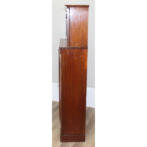 34 - A very unusual Mahogany cupboard or standing clerks desk, the top with drop down front concealing 6 ... 