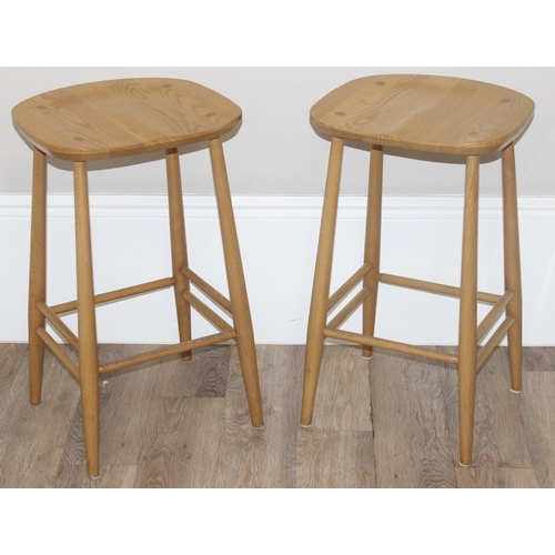 38 - A pair of Ercol kitchen counter or bar stools, blonde finish, with labels under, each approx 39cm wi... 