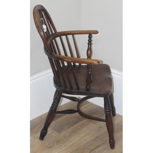 47 - An antique farmhouse horseshoe armchair with hoop back and oak or elm seat, approx 91cm tall