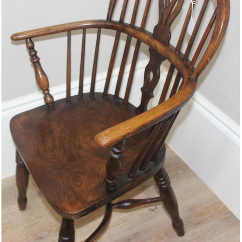 47 - An antique farmhouse horseshoe armchair with hoop back and oak or elm seat, approx 91cm tall