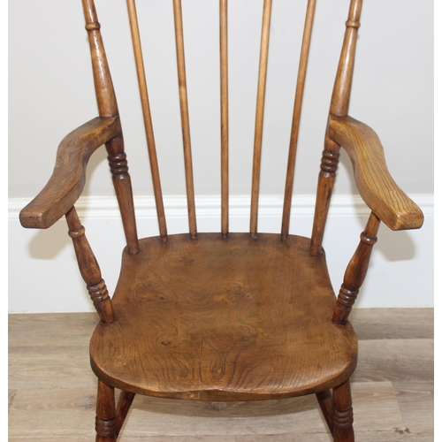 48 - A vintage stickback farmhouse armchair with elm seat, approx 110cm tall