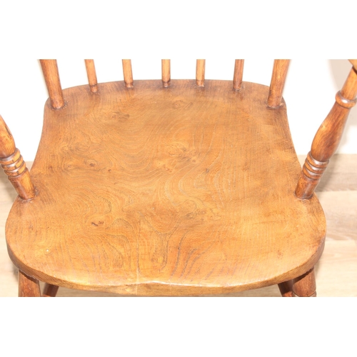 48 - A vintage stickback farmhouse armchair with elm seat, approx 110cm tall