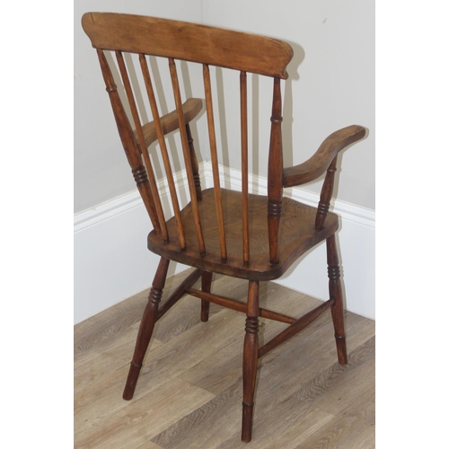 48 - A vintage stickback farmhouse armchair with elm seat, approx 110cm tall