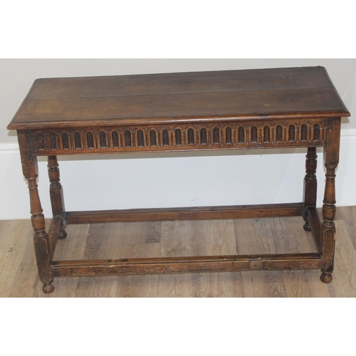 56 - A 17th century style oak hall table with carved apron, approx 111cm wide x 47cm deep x 70cm tall