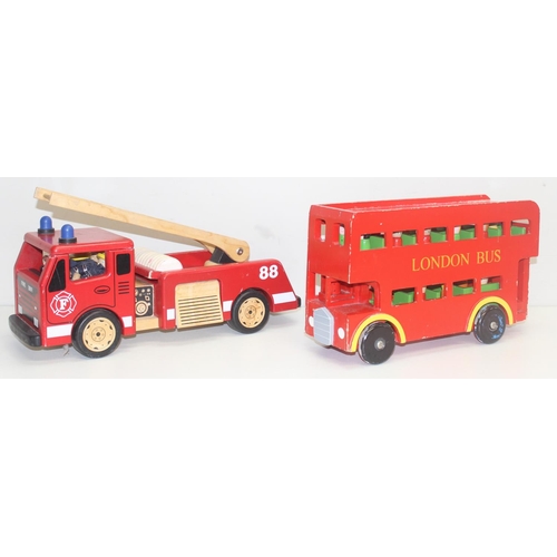 601 - An interesting vintage scratch built wooden model of a London bus with passengers and a wooden toy f... 