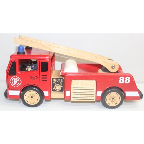 601 - An interesting vintage scratch built wooden model of a London bus with passengers and a wooden toy f... 