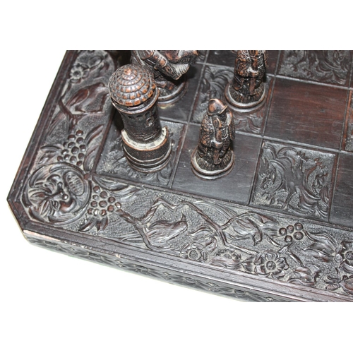 605 - Large vintage resin chessboard and chess set, the board decorated with birds and flowers, king piece... 