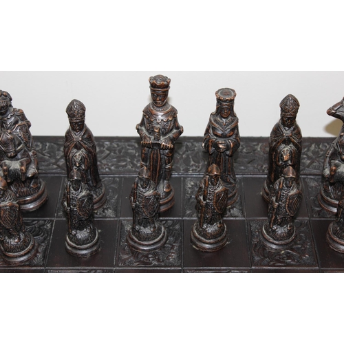 605 - Large vintage resin chessboard and chess set, the board decorated with birds and flowers, king piece... 