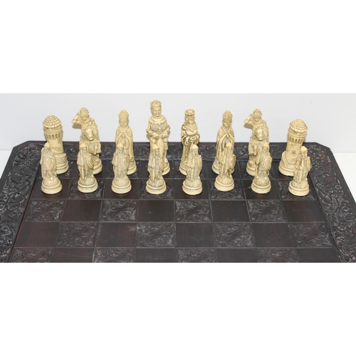 605 - Large vintage resin chessboard and chess set, the board decorated with birds and flowers, king piece... 