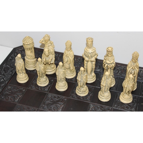 605 - Large vintage resin chessboard and chess set, the board decorated with birds and flowers, king piece... 