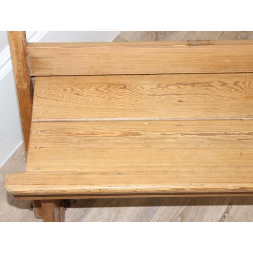 65 - A very unusual metamorphic pitch pine bench or pew with movable back allowing it to be sat one side ... 