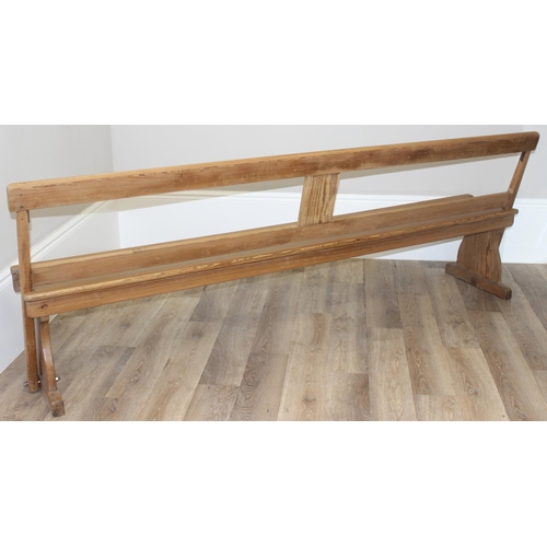 65 - A very unusual metamorphic pitch pine bench or pew with movable back allowing it to be sat one side ... 