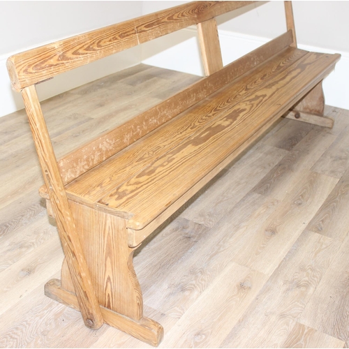 66 - A very unusual metamorphic pitch pine bench or pew with movable back allowing it to be sat one side ... 