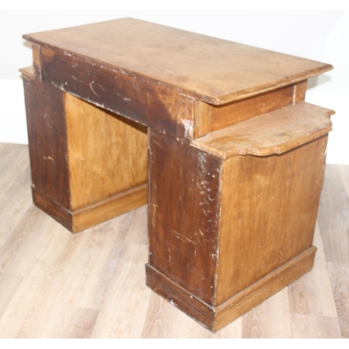 67 - An early 20th century light oak desk with 8 drawers and brass handles, unusual construction, approx ... 