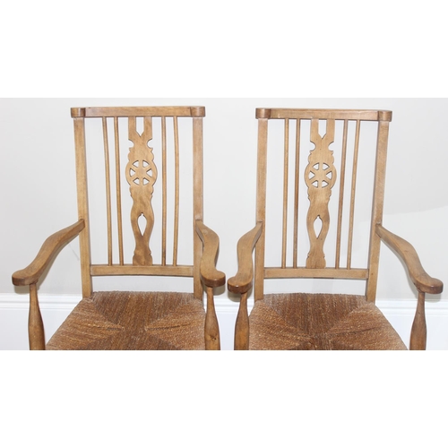 68 - A set of 4 Arts & Crafts period chairs with rush seats, 2 carver and 2 dining, the carvers approx 10... 