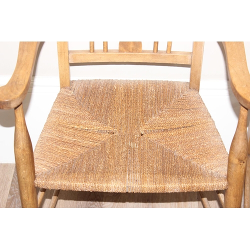 68 - A set of 4 Arts & Crafts period chairs with rush seats, 2 carver and 2 dining, the carvers approx 10... 