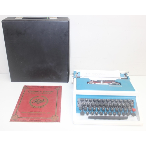 701 - A retro Underwood 315 typewriter in case, white and turquoise pattern