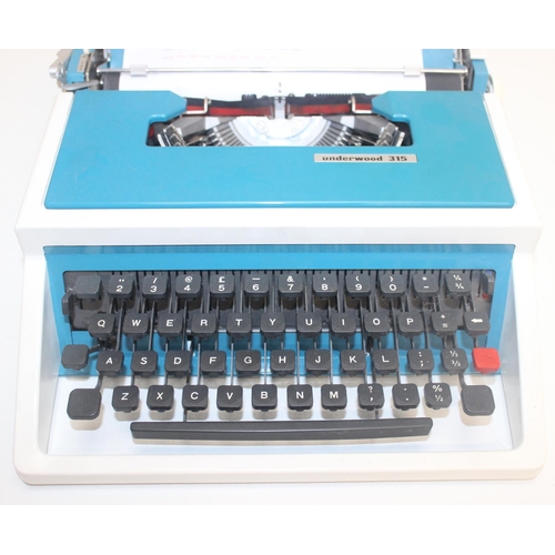 701 - A retro Underwood 315 typewriter in case, white and turquoise pattern