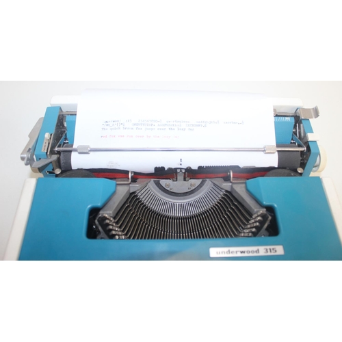 701 - A retro Underwood 315 typewriter in case, white and turquoise pattern