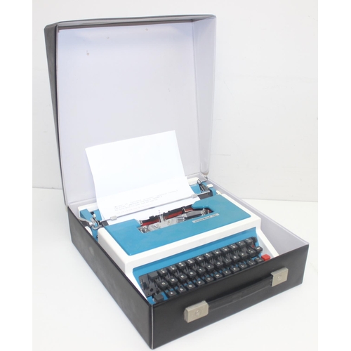 701 - A retro Underwood 315 typewriter in case, white and turquoise pattern