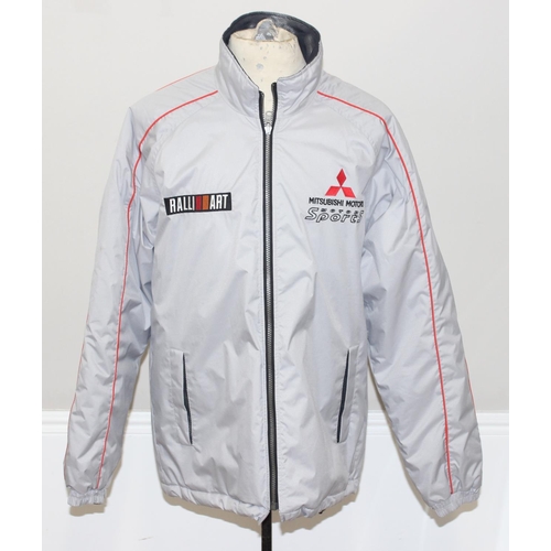 713 - A vintage Mitsubishi Motors Motorsport Ralli Art jacket or coat, size LL, mainly silver colour