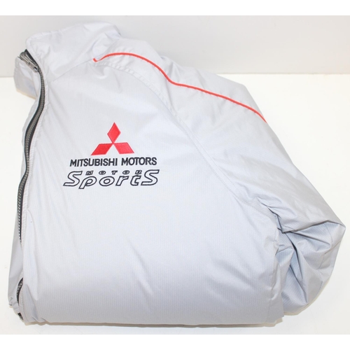 713 - A vintage Mitsubishi Motors Motorsport Ralli Art jacket or coat, size LL, mainly silver colour