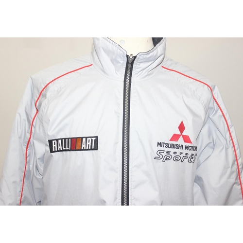 713 - A vintage Mitsubishi Motors Motorsport Ralli Art jacket or coat, size LL, mainly silver colour