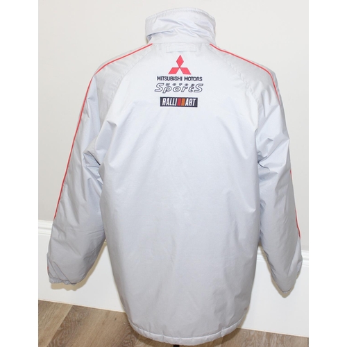 713 - A vintage Mitsubishi Motors Motorsport Ralli Art jacket or coat, size LL, mainly silver colour