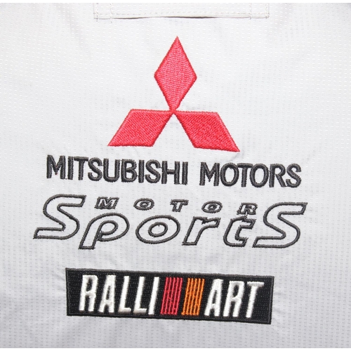 713 - A vintage Mitsubishi Motors Motorsport Ralli Art jacket or coat, size LL, mainly silver colour