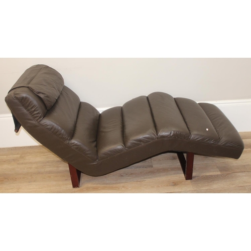 72 - A retro style brown faux lounger and associated footstool, the lounger approx 170cm long x 68cm deep... 