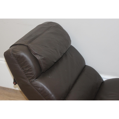 72 - A retro style brown faux lounger and associated footstool, the lounger approx 170cm long x 68cm deep... 